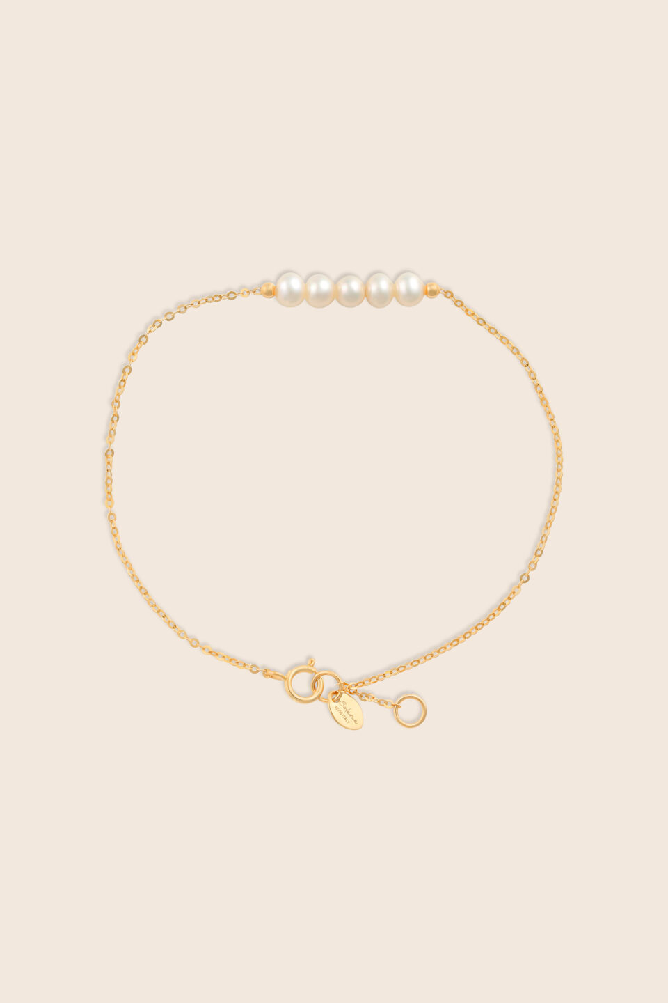 Lavita yellow gold bracelet with five stacked pearl beads