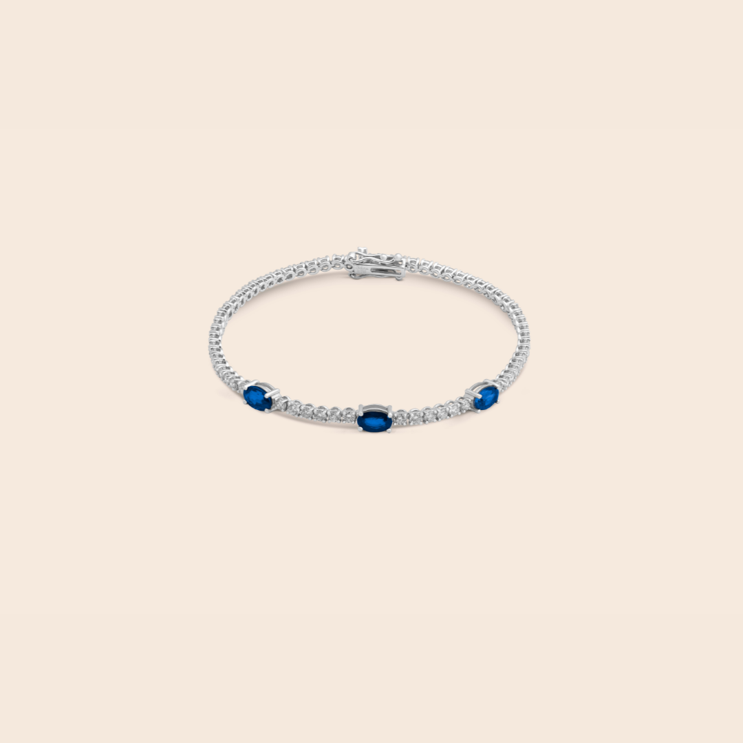 ADBR000615-image-653-31 Classic white gold blue sapphire and diamond tennis bracelet - Image 1
